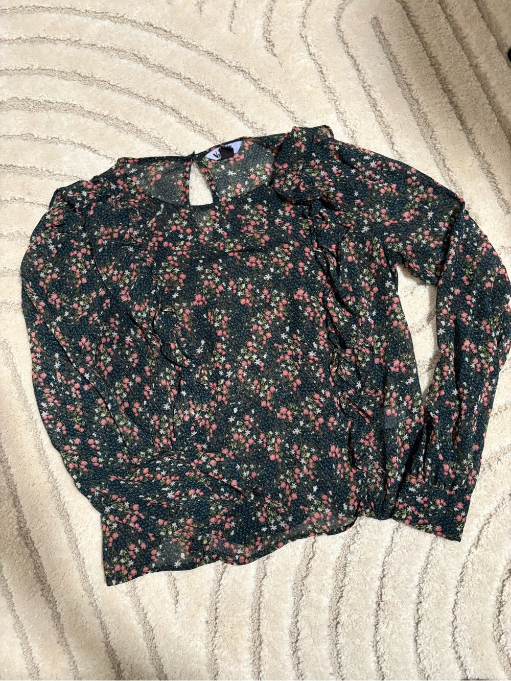 Sheer floral blouse with ruffle detail down front